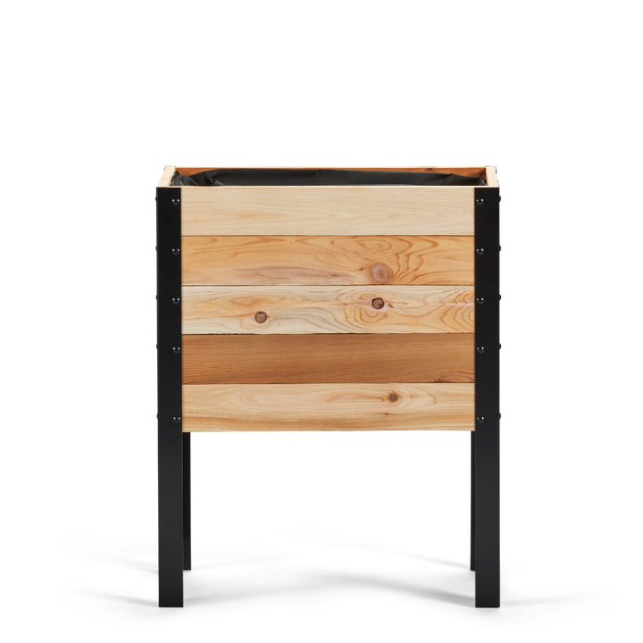 Wooden planter box with black metal frame on a white background