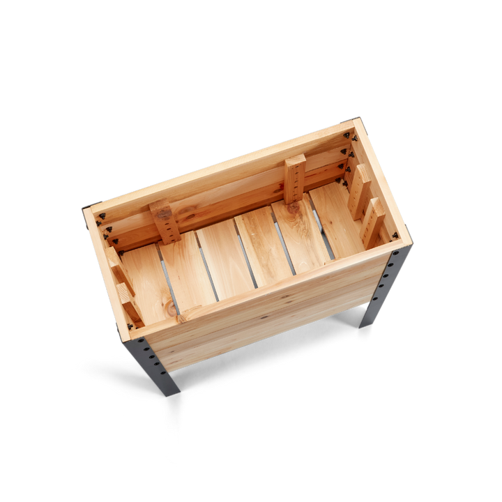 Wooden crate with metal legs on a white background
