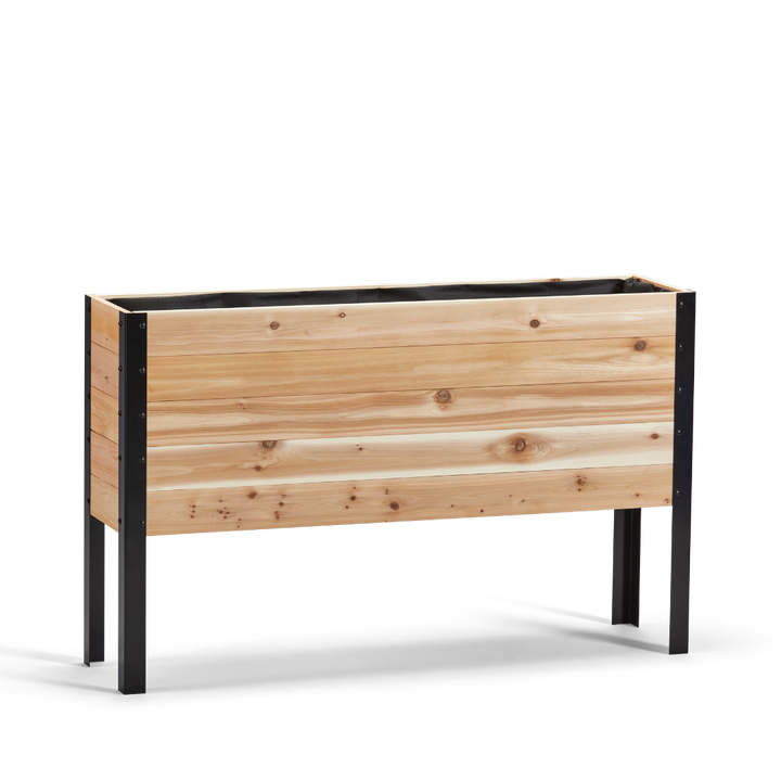 Wooden planter box with black metal legs on a white background