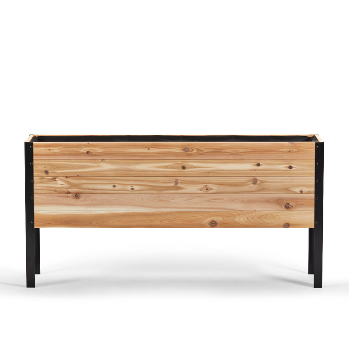 Wooden planter box with black metal frame on a white background